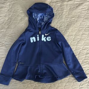 Girls, Nike zip up with ruffle detail and tie-dye in her hood